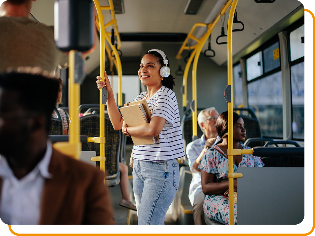 Image of a person stood up on a bus