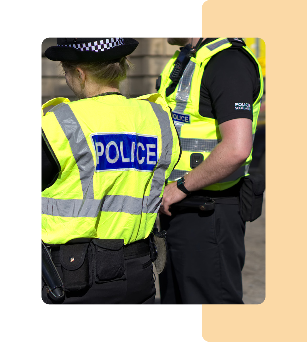 Image of two police officers stood on a street