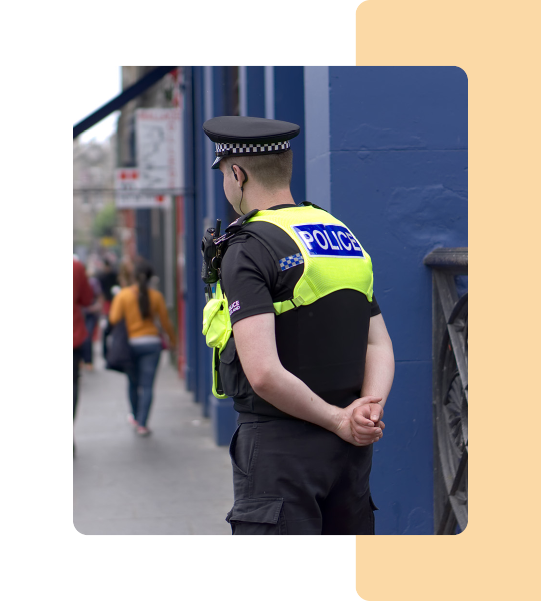 Image of a police officer stood on a street