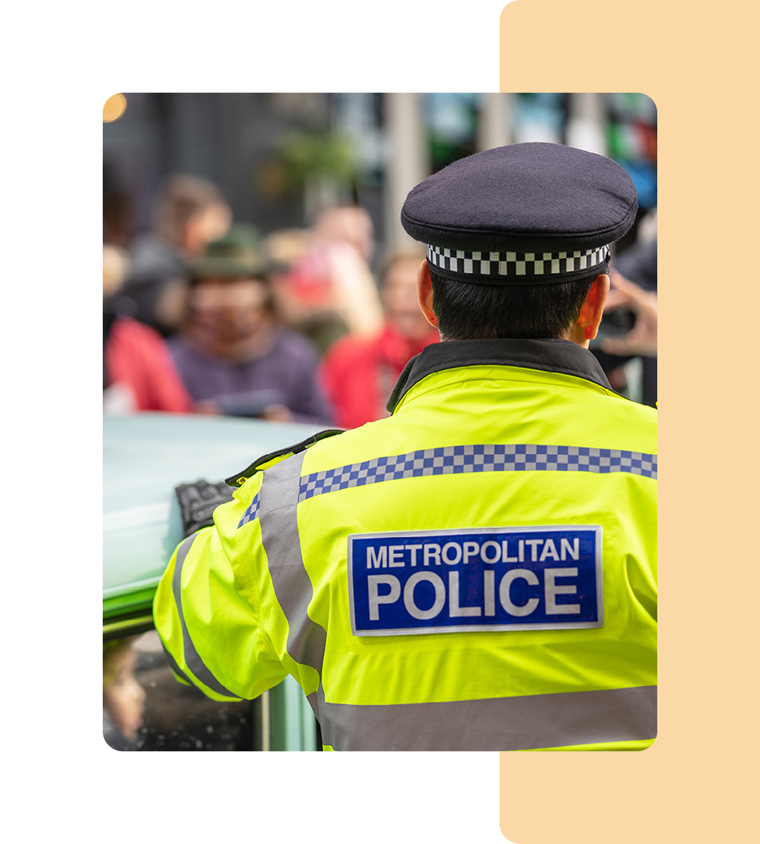 Image of a police officer stood on a street