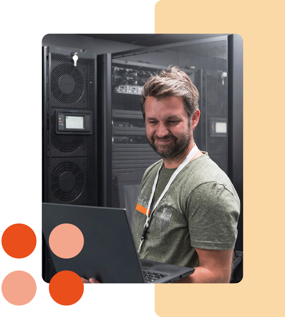 Image of an IT professional working on a laptop in a server room