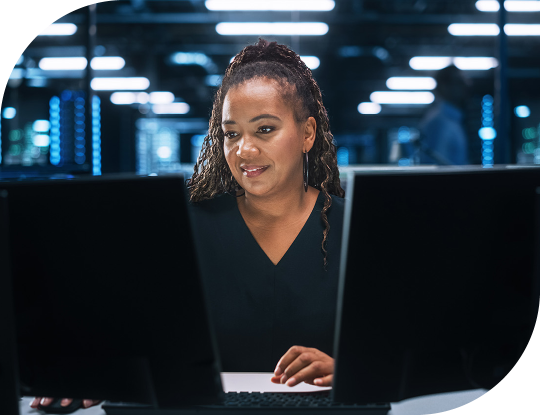 Image of an IT professional working on a computer