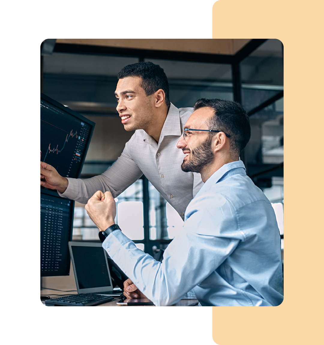 Image of two colleagues working on a computer together