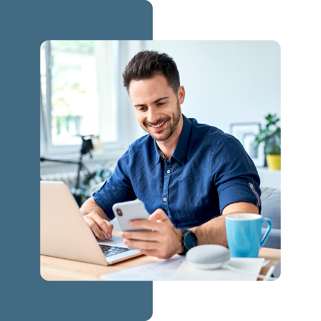 Image of a smiling remote worker on a laptop