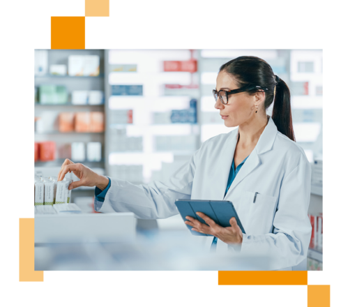 Image of a pharmaceuticals worker holding a tablet