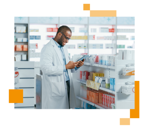 Image of a pharmaceuticals worker holding a tablet