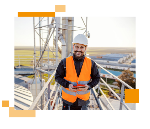 Image of a telecommunications engineer stood at a telephone mast