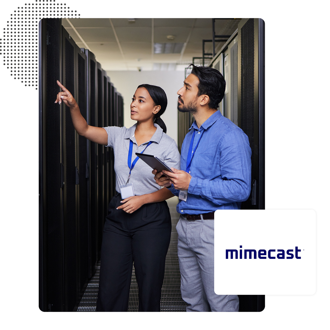 Two people talking in a data cenrre room with a Mimecast logo