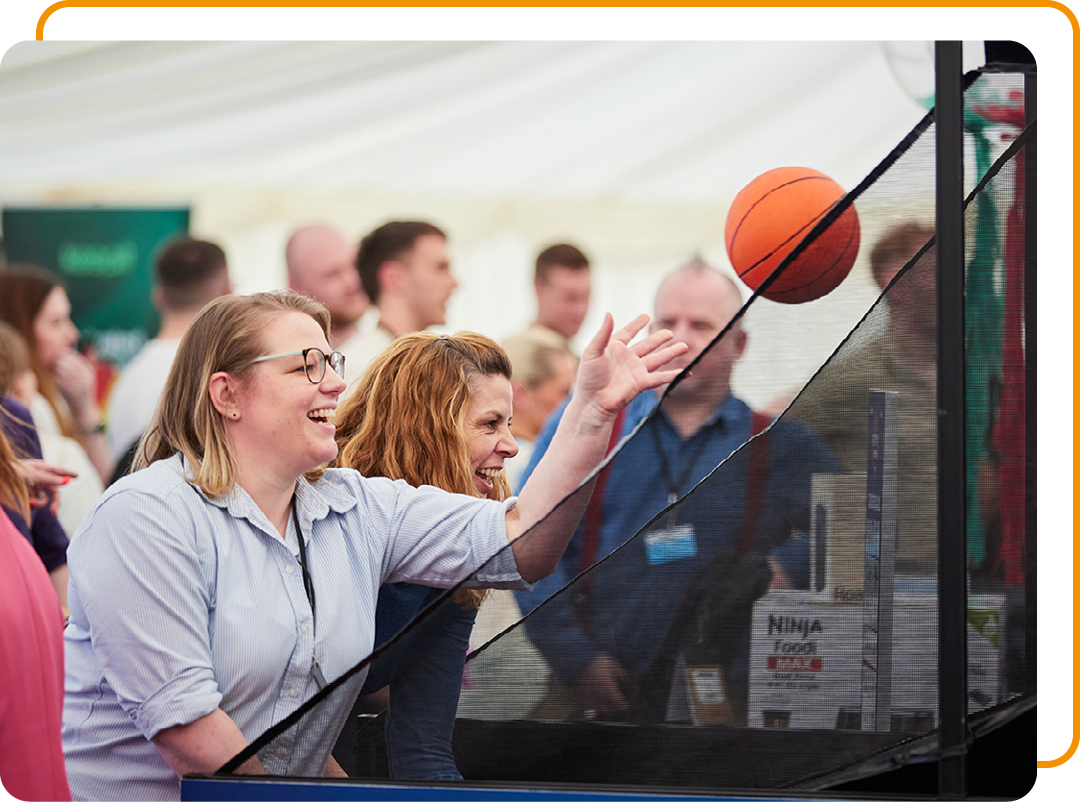 Image of Phoenix Software employees playing basketball at a employee event