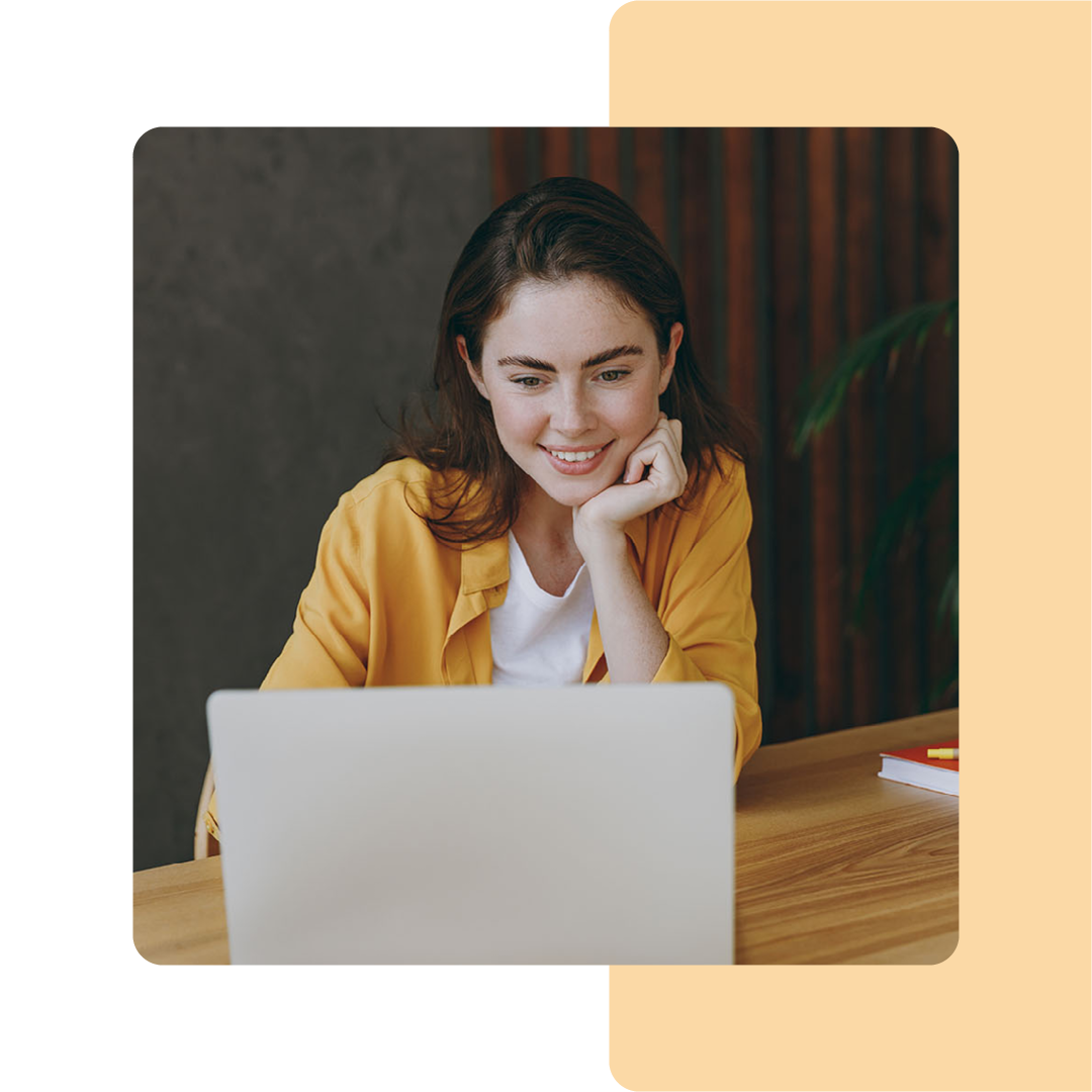 Image of a person working on a laptop