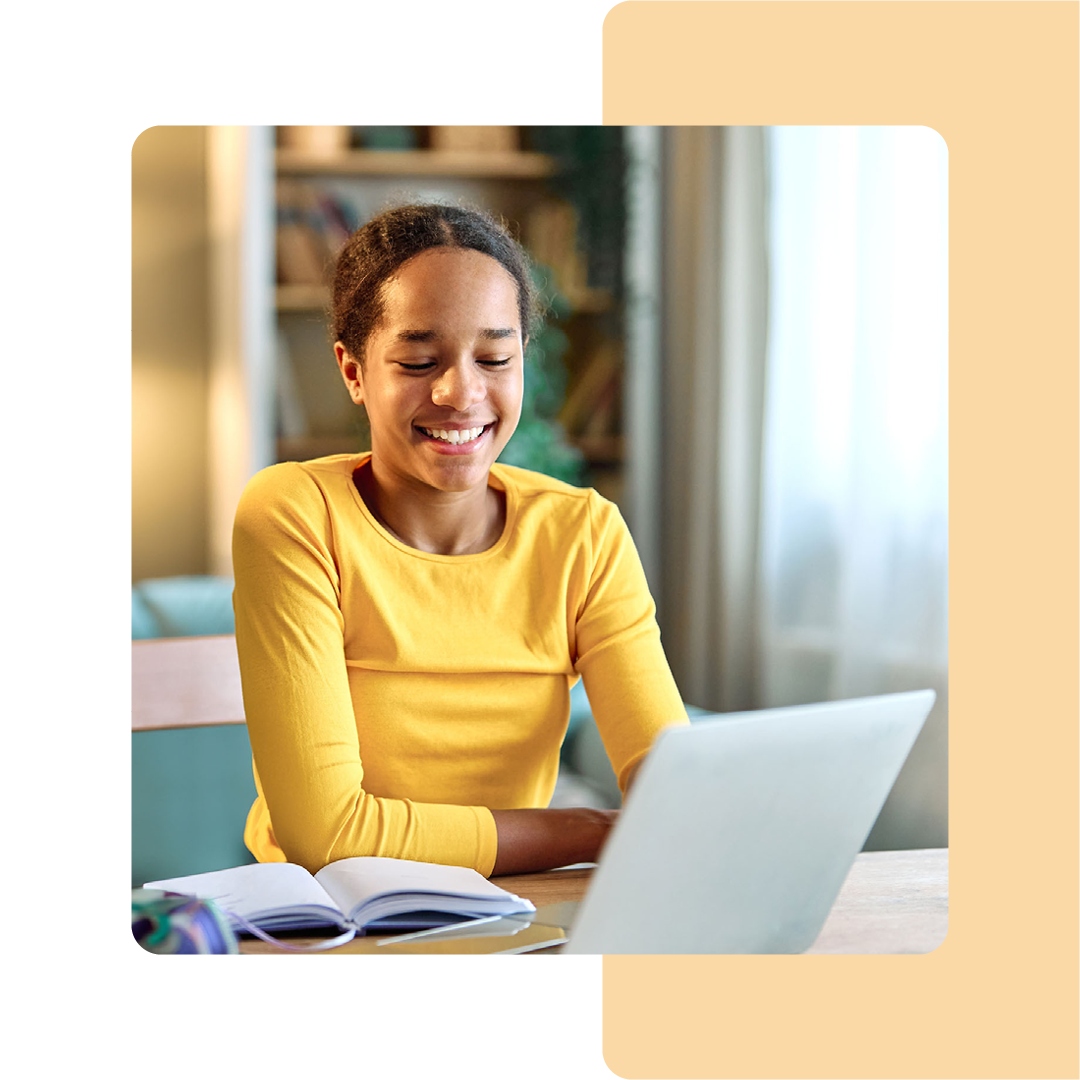 Image of a person working on a laptop