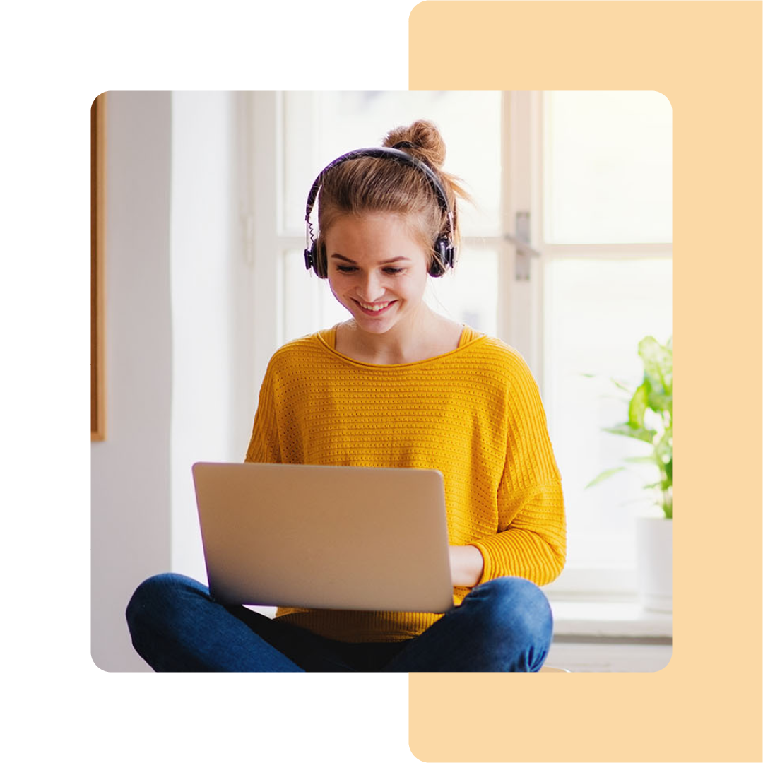 Image of a student working on a laptop at home