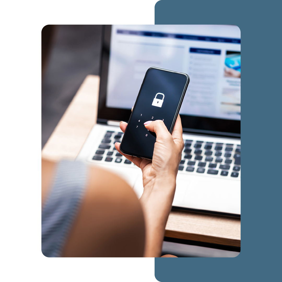 Image of a person holding a mobile phone with a padlock on the screen