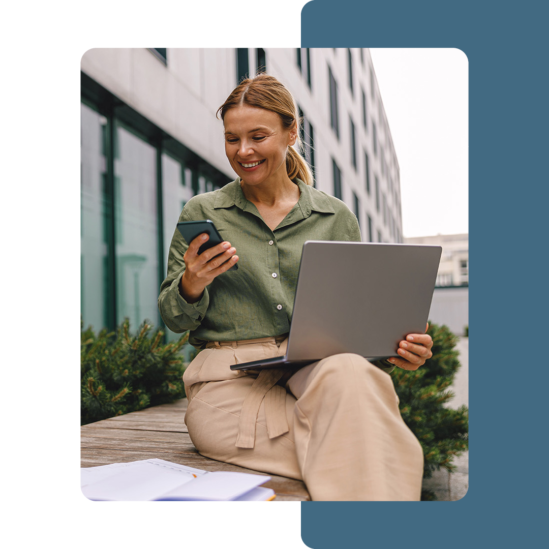 Image of a person working remotely outside on a laptop