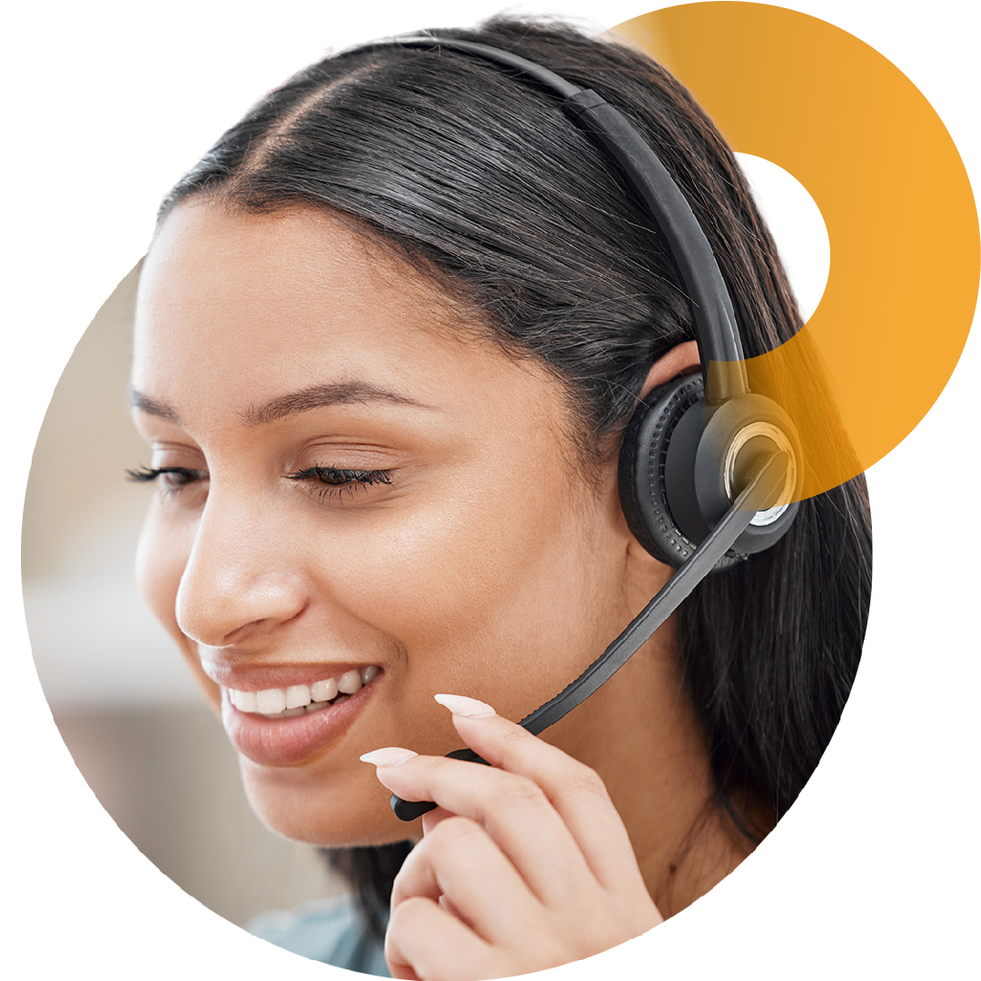 Image of a smiling person talking on a headset