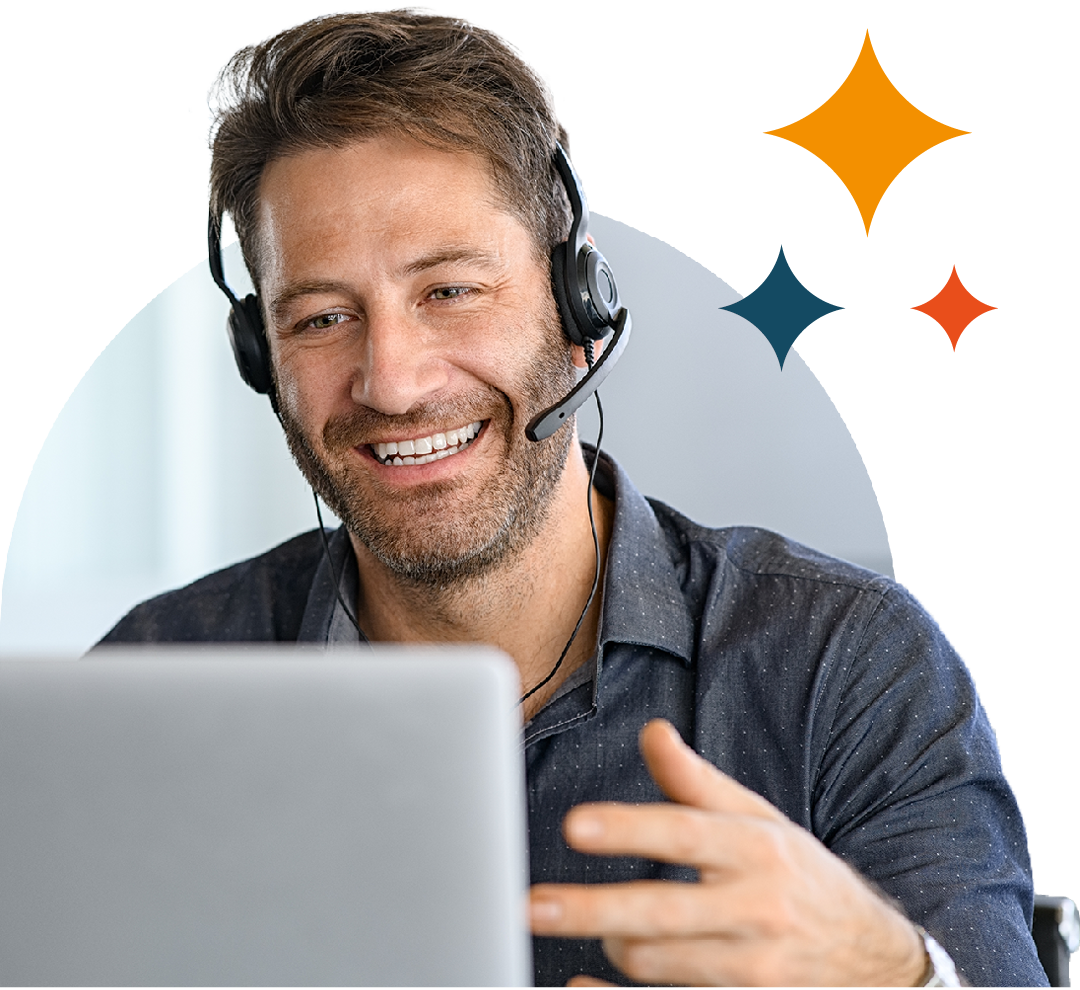 Image of an IT support professional talking on a headset while working on a laptop