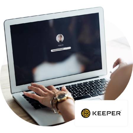 Image of a person logging into their laptop with the Keeper logo