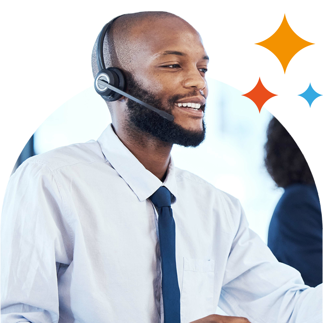 Image of an IT support professional talking on a headset in an office