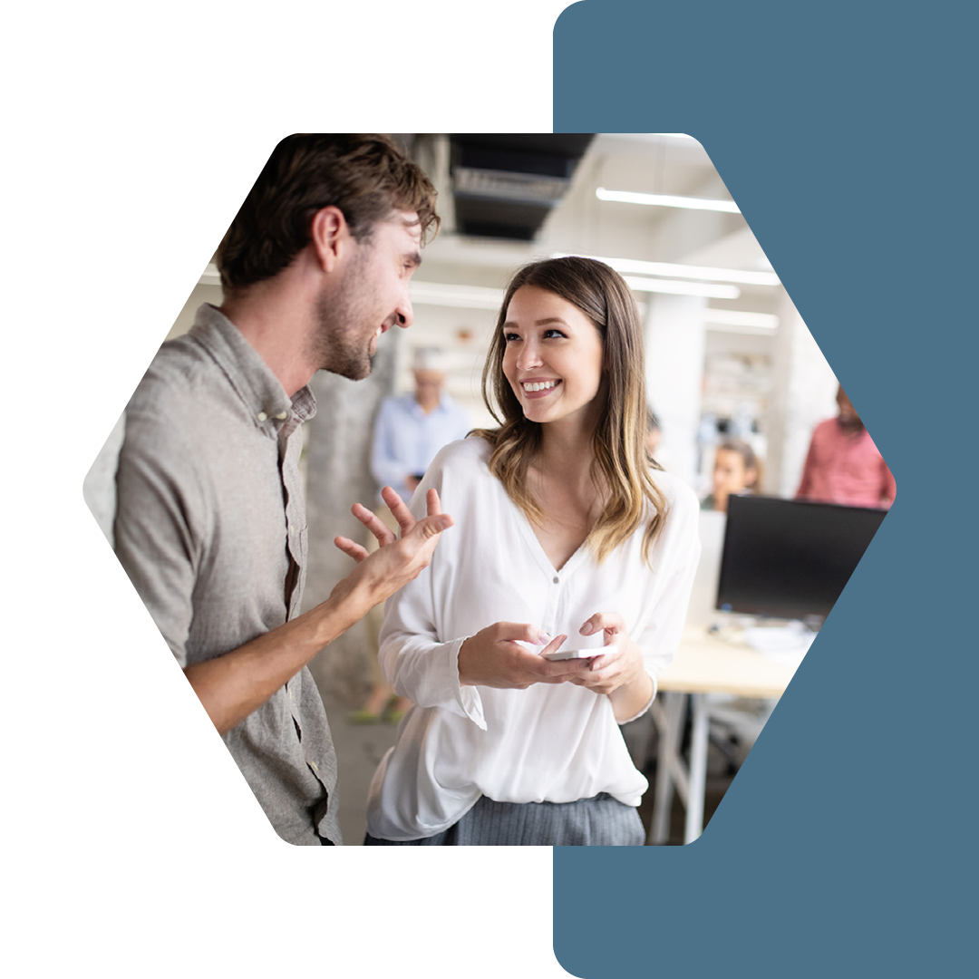 Image of two people laughing in conversation