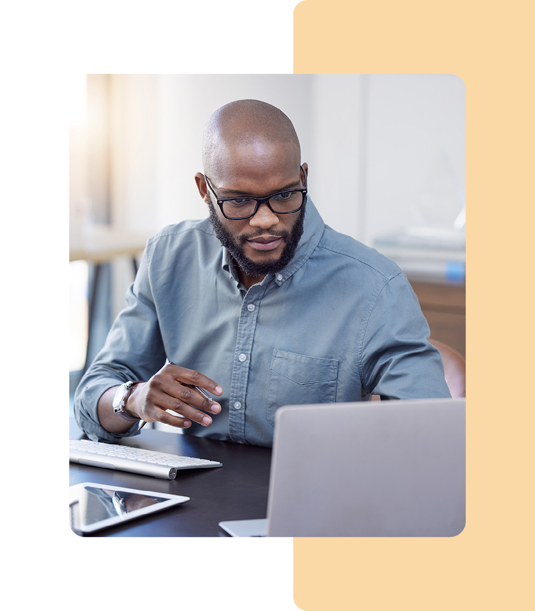 Image of an IT professional working on a laptop