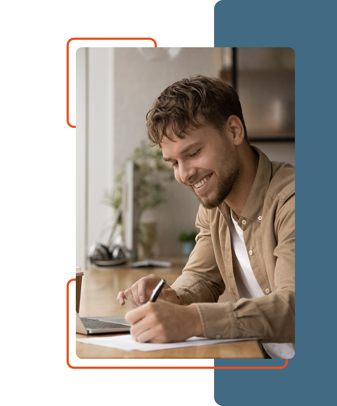 Image of a person smiling while working at their desk