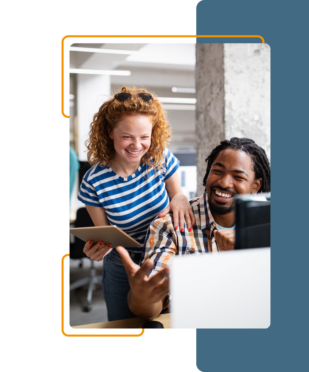 Image of two people working together on a computer