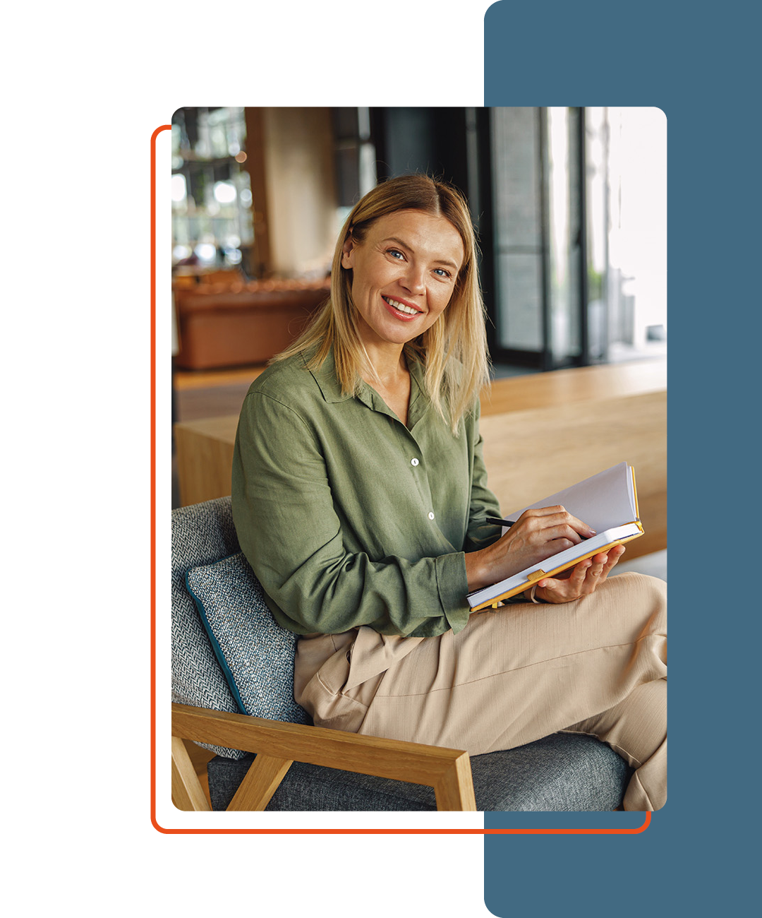 Image of a person sat on a seat with a book in their hand