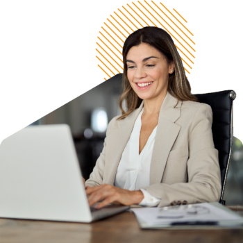 Image of a person working on a laptop at a desk