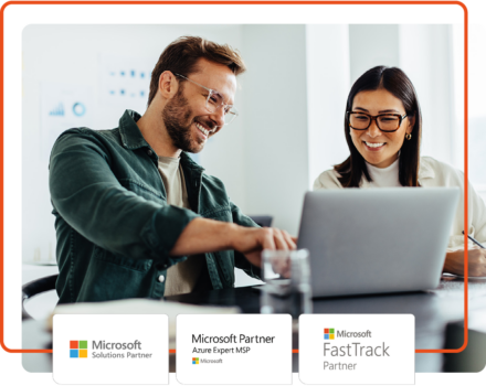 Two people smiling working on a laptop. Microsoft Solutions Partner, Microsoft Azure MSP, and Microsoft FastTrack logos