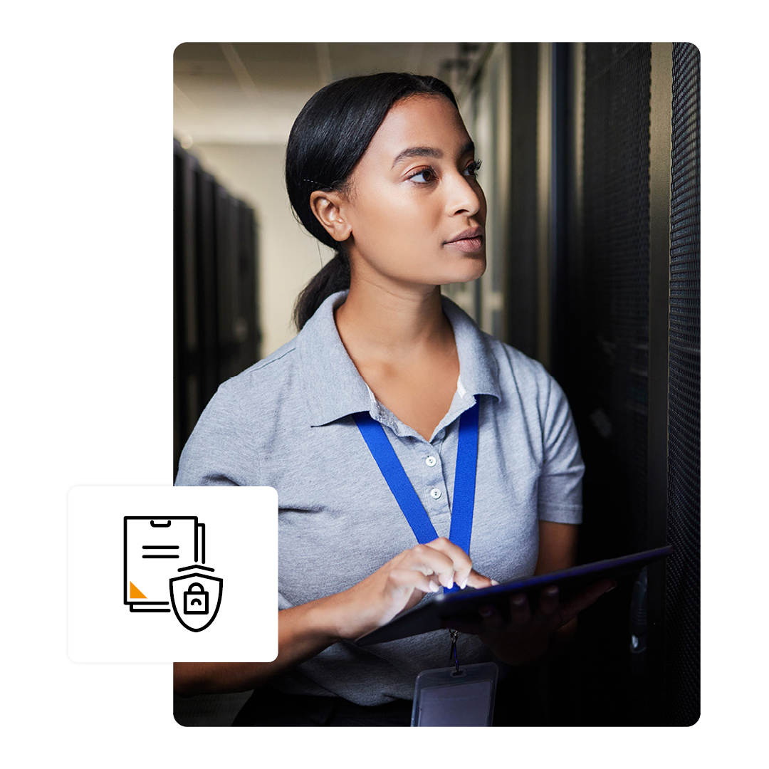 Person in a server room working on a tablet