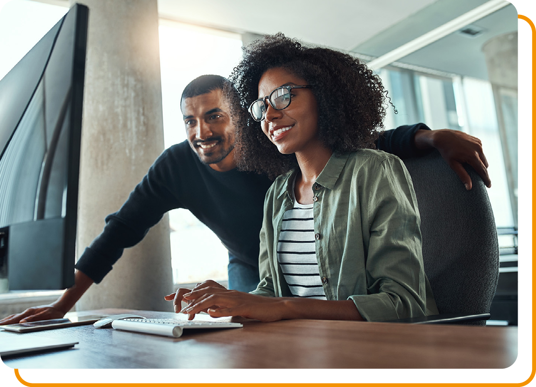 Image of two business colleagues working together on a computer