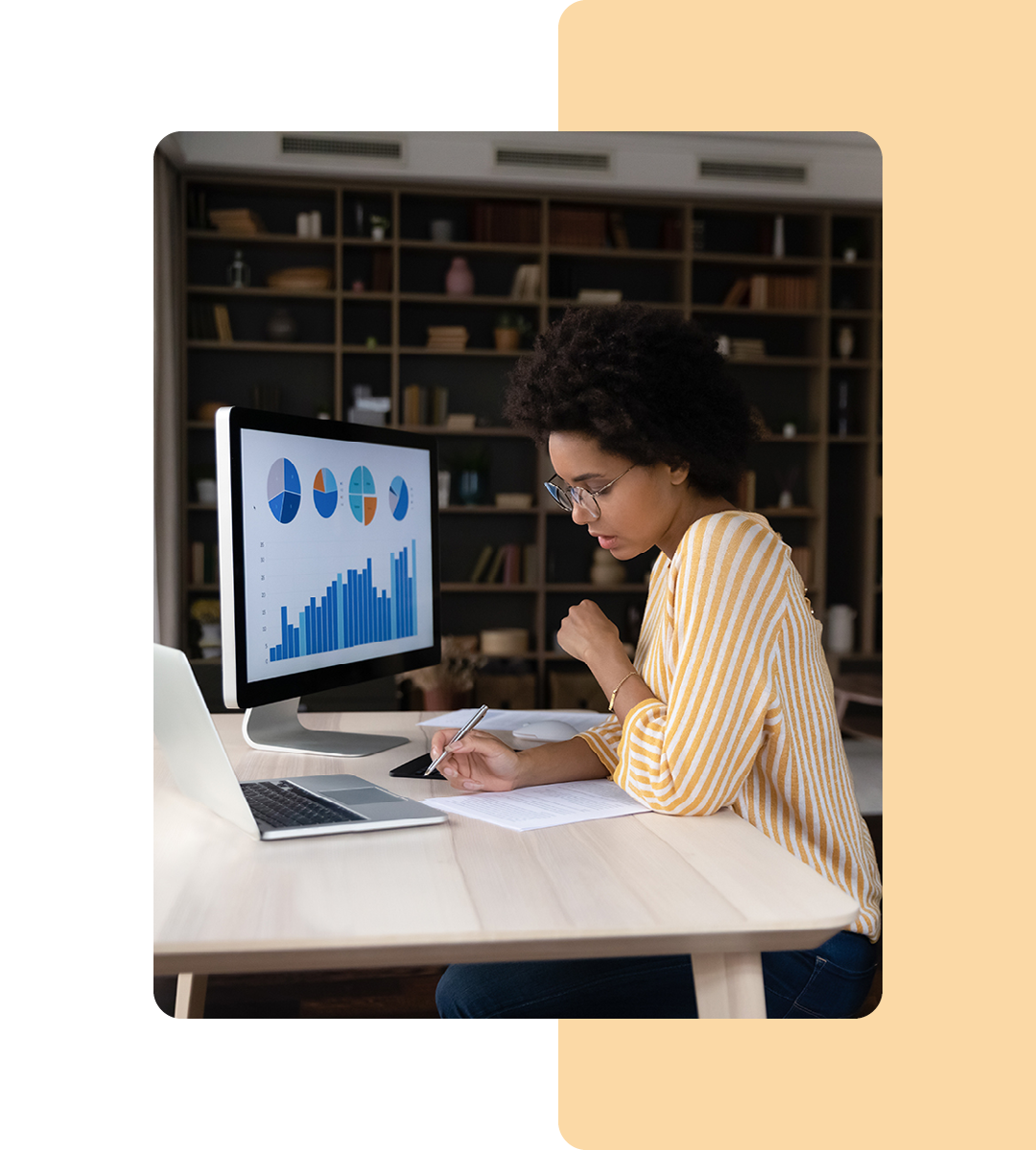 Image of a data analyst analysing data on a computer