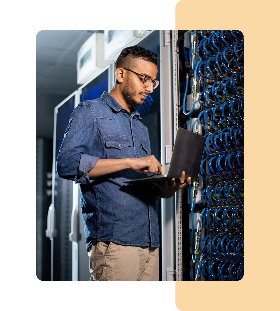 Image of an IT professional working in a server room