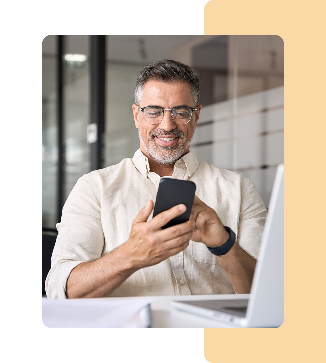 Image of a business professional on their mobile phone in an office environment