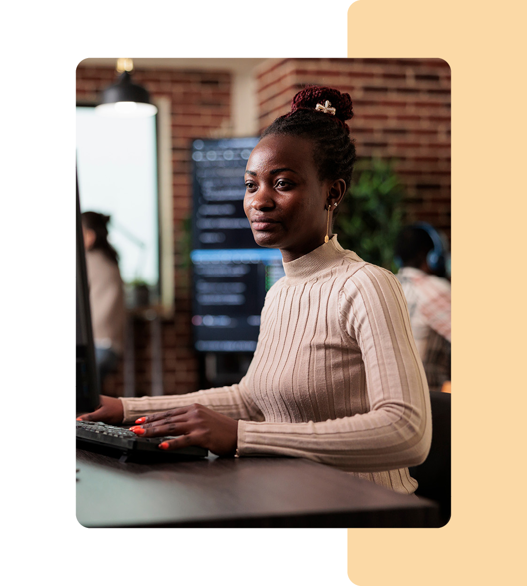 Image of an IT professional working at a desk