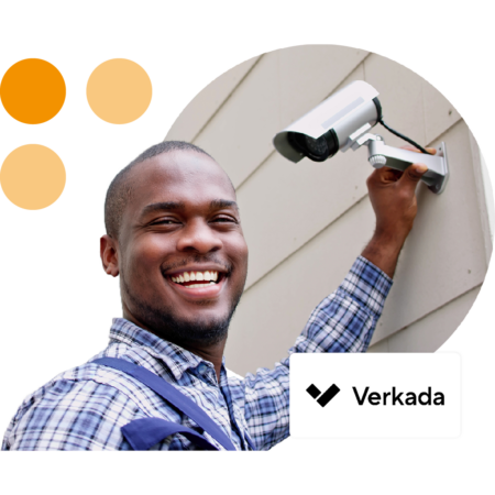 Image of a person installing a security camera with the Verkada logo