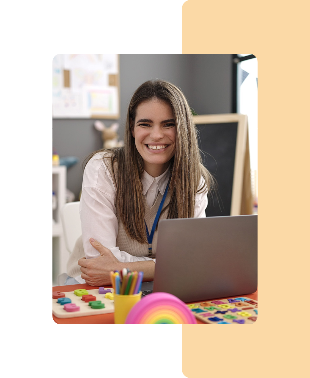 Image of a school teacher working on a laptop