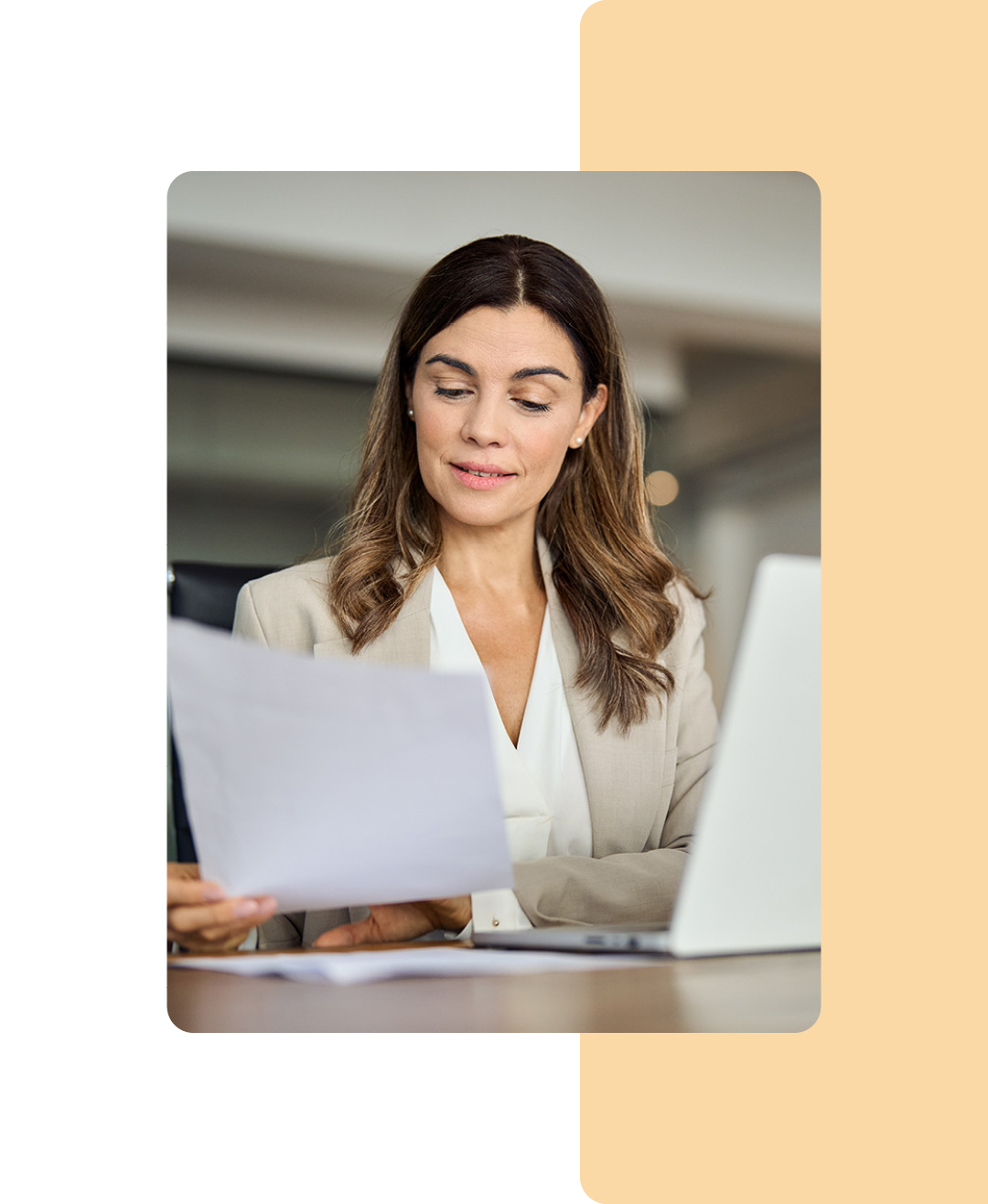 Image of a financial worker analysing information on a piece of paper