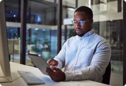 Image of a cyber security professional working on a tablet