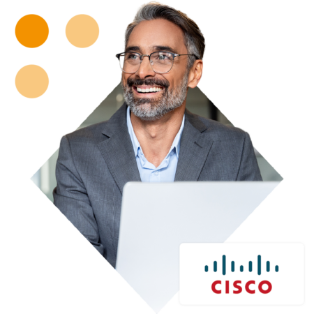 Image of a smiling business professional working on a laptop with the Cisco logo