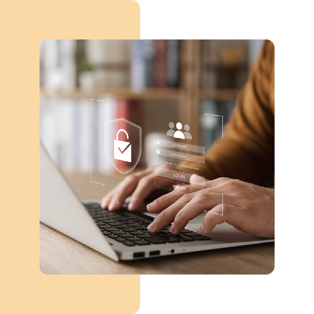 Image of a person typing on a laptop with a security padlock visual