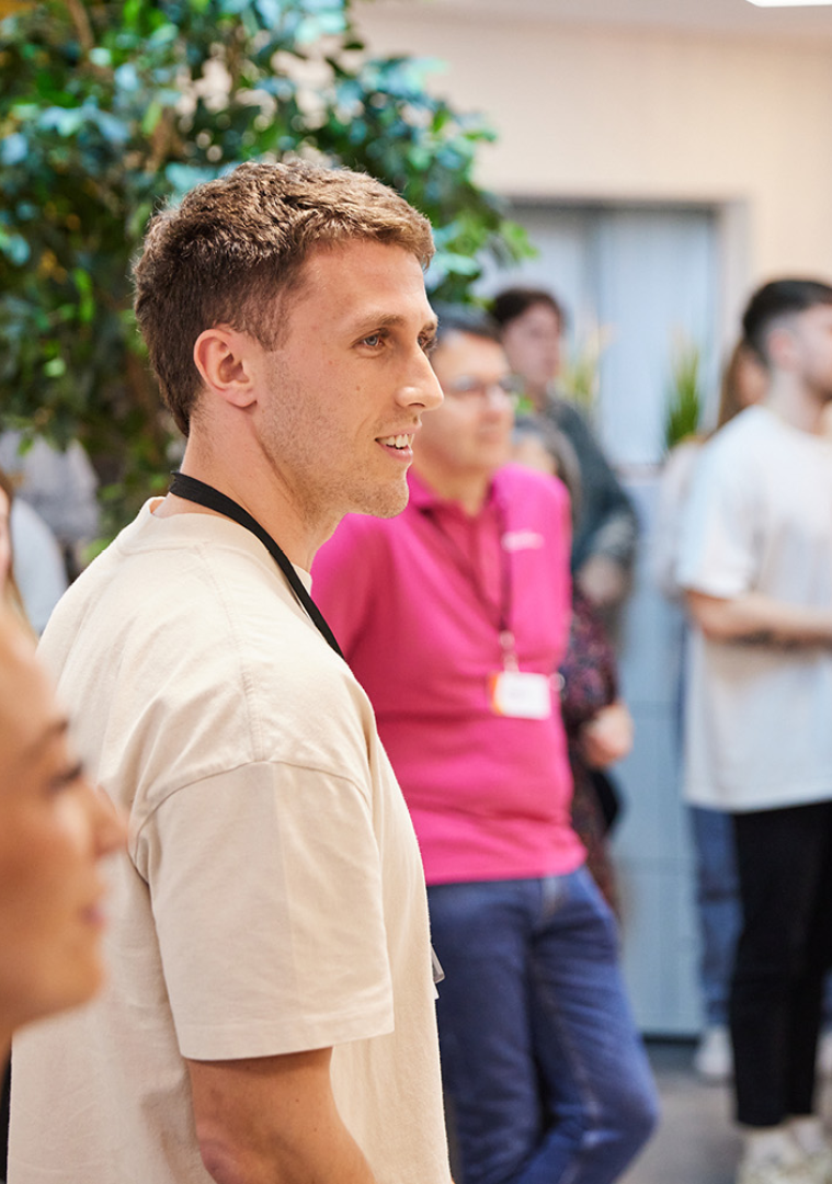 Image of Phoenix Software employees stood at a town hall