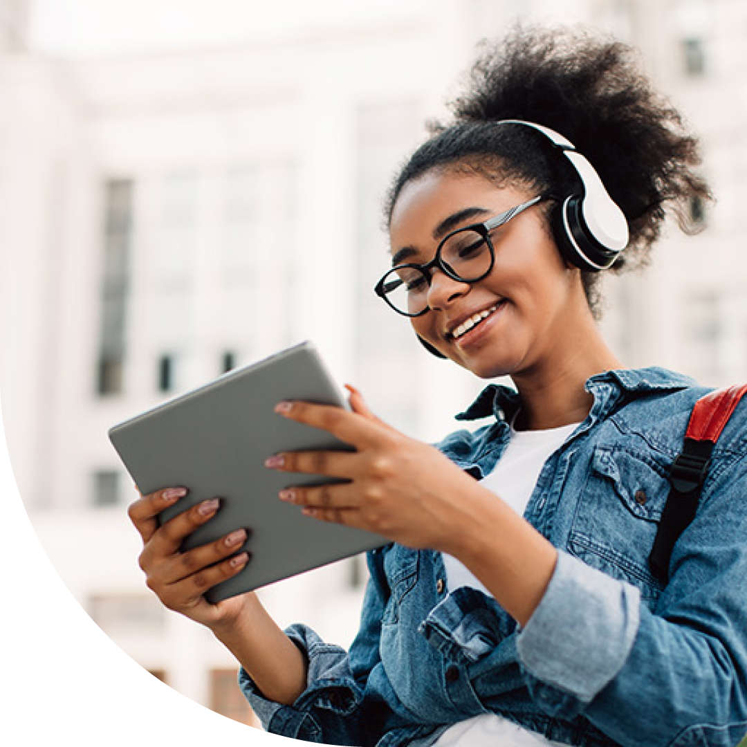 Image of a smiling university student working on a tablet