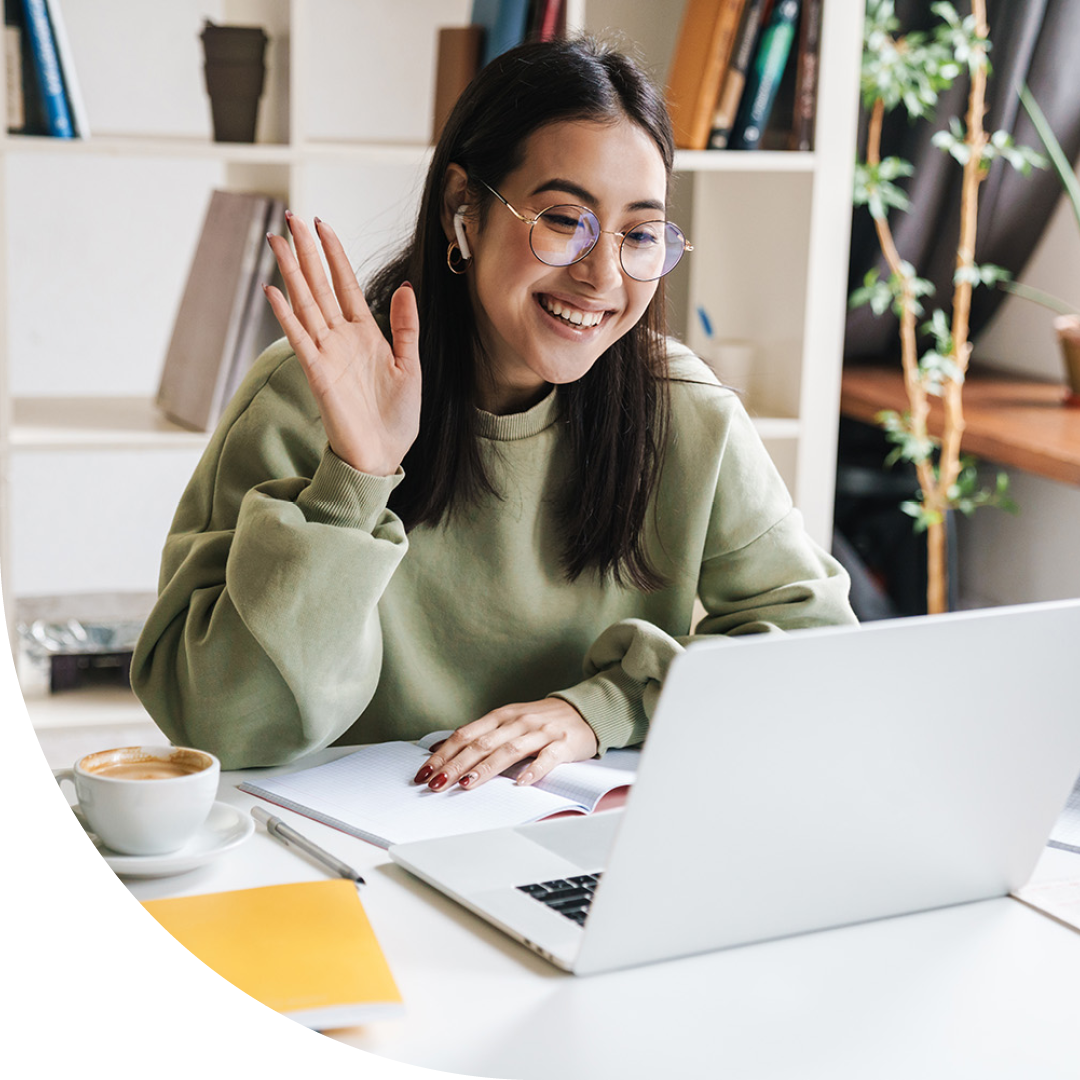 Image of a smiling university student talking on a virtual call